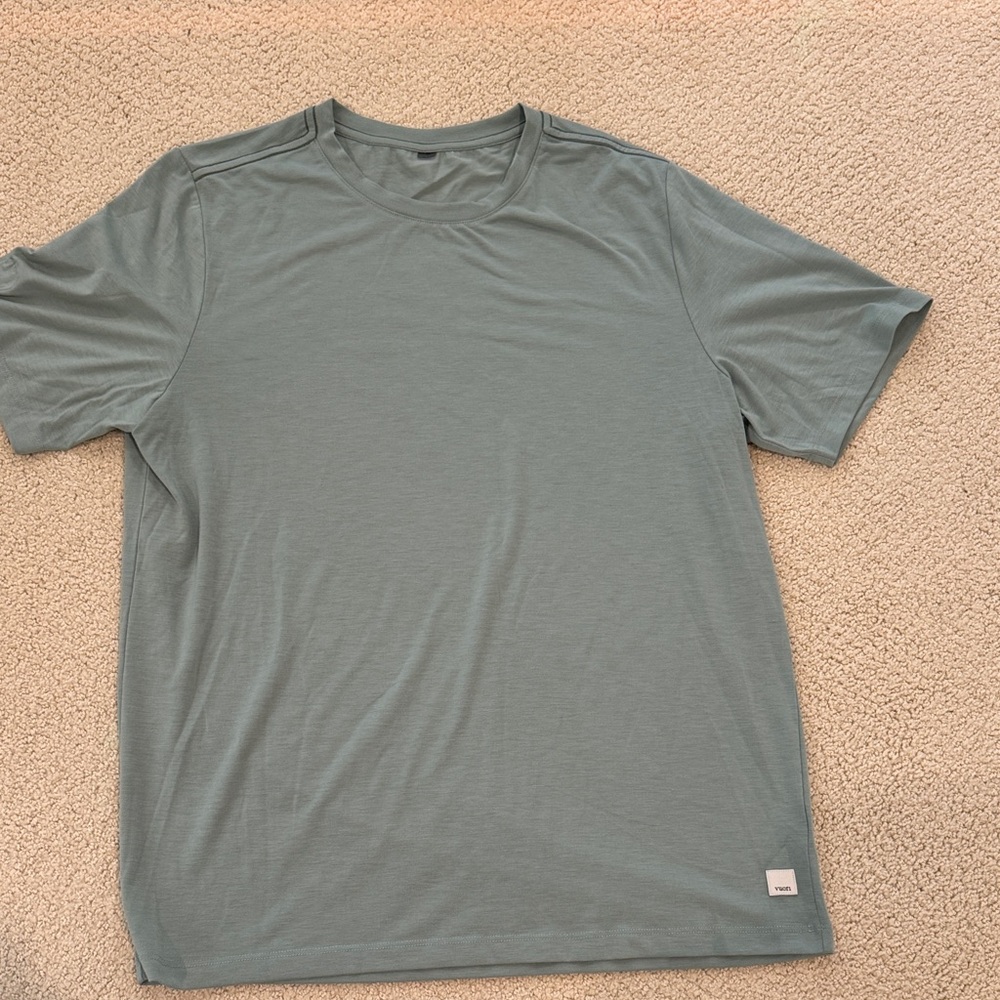 Vuori Men's Current Tech Tee size medium in light greenish blue.